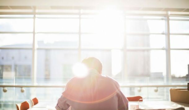 Man at desk in sunlight